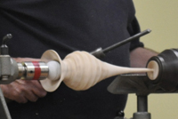 Holding a vase with a golf ball