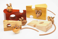 Wooden mice on cheese